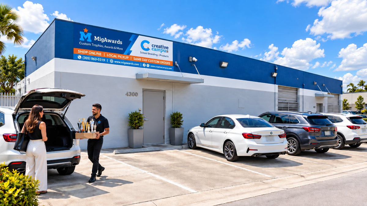MigAwards showroom and warehouse at 4300 East 10th Lane in Hialeah, Florida, with a customer picking up trophies